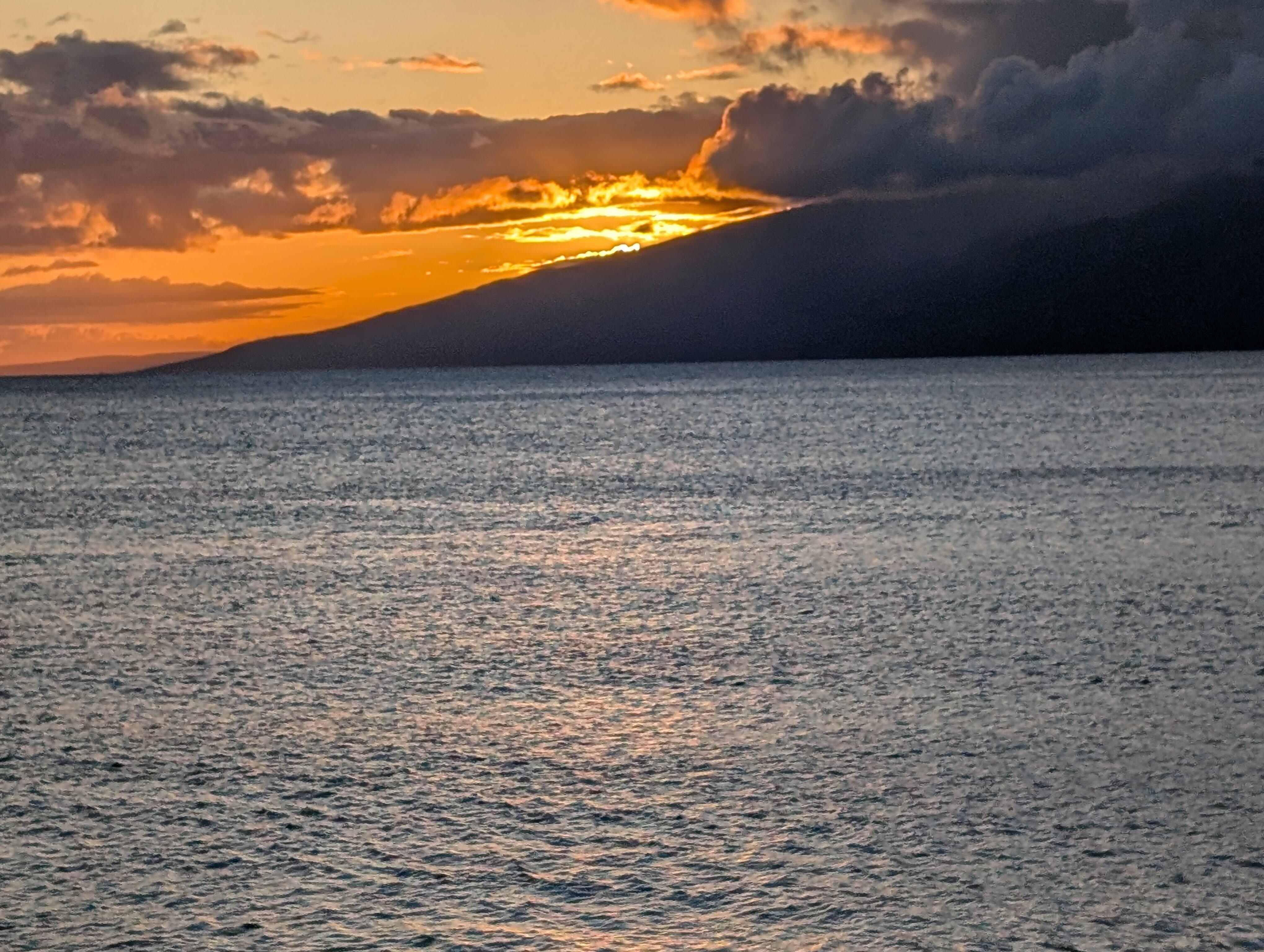 Sunsetting behind Molaki 