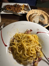 Spaghetti Carbonara with white Truffle Sauce and butter.  The best pasta dish I ever had. Osteria Caffe Italiano