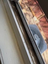 Caked dirt/dust in window sills