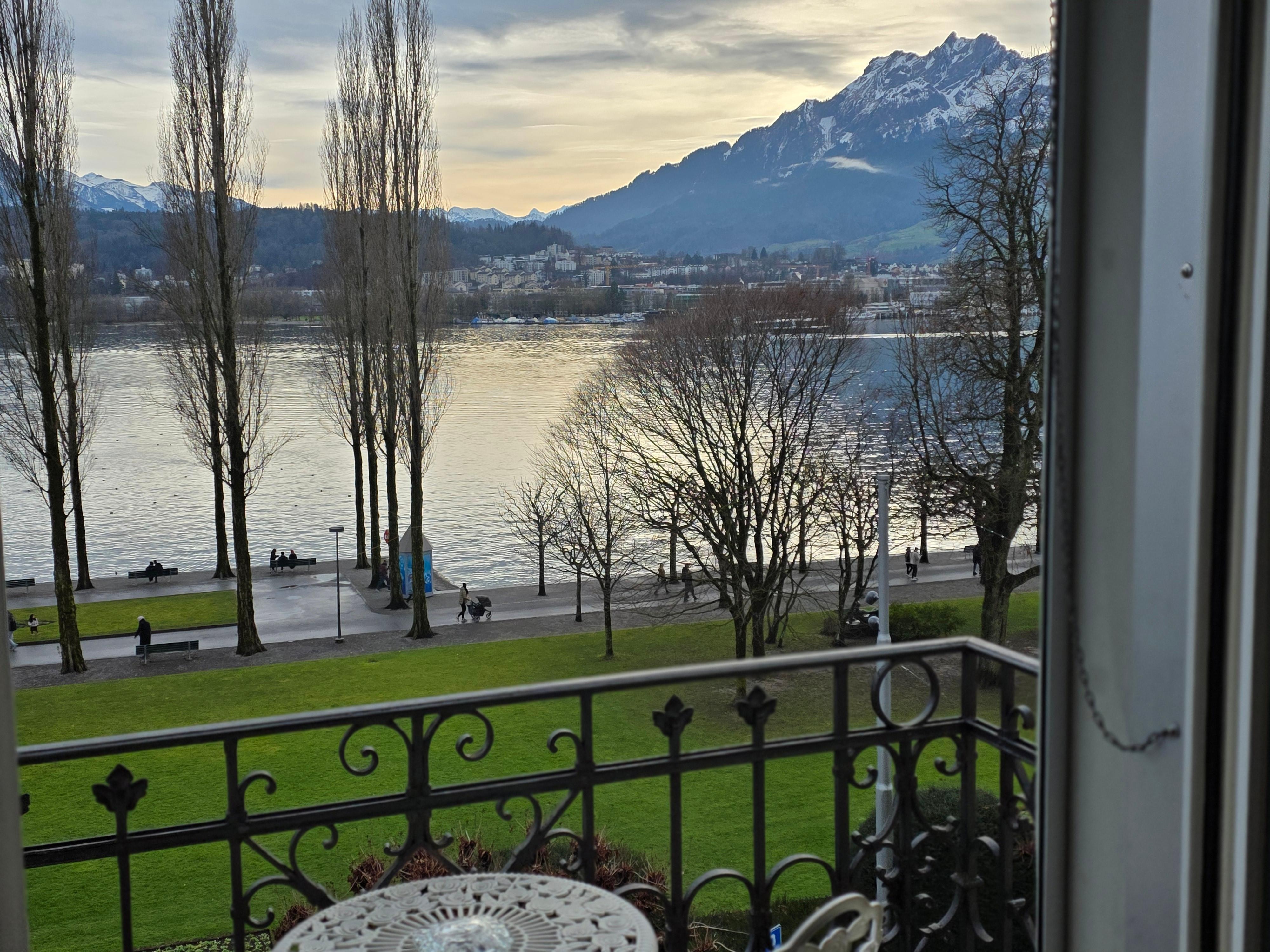 Balcony view of the lake and mountains. 