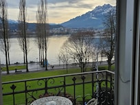 Balcony view of the lake and mountains.