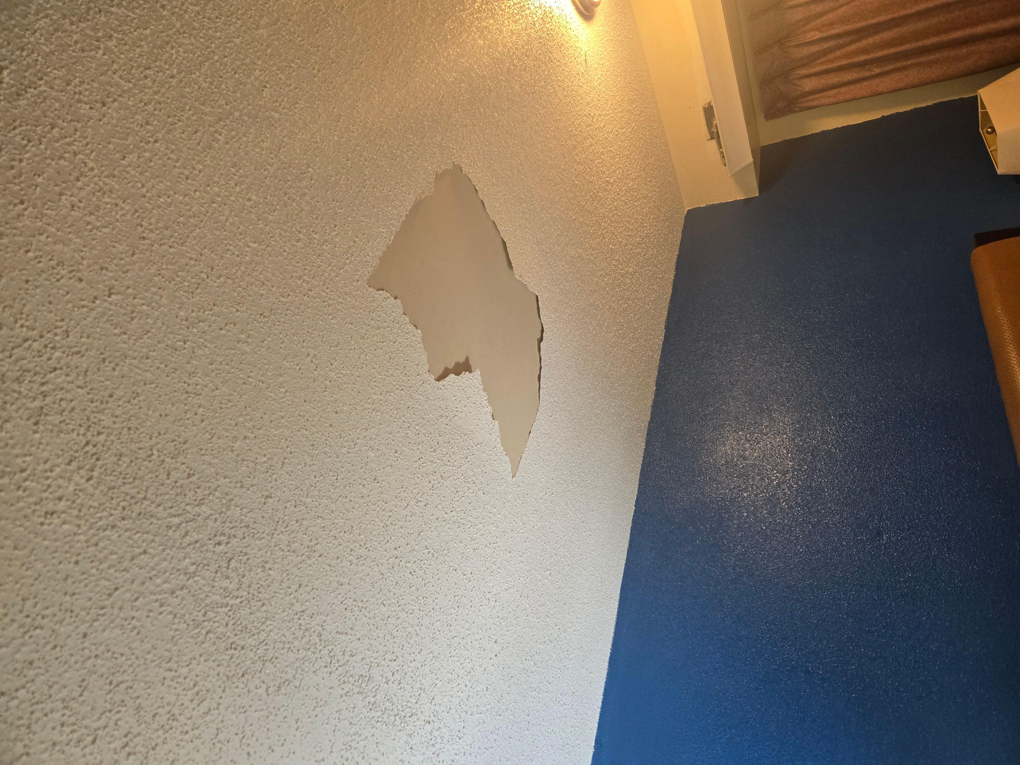 Ceiling above the bed in room 342 flakes were on the bed.