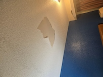 Ceiling above the bed in room 342 flakes were on the bed.