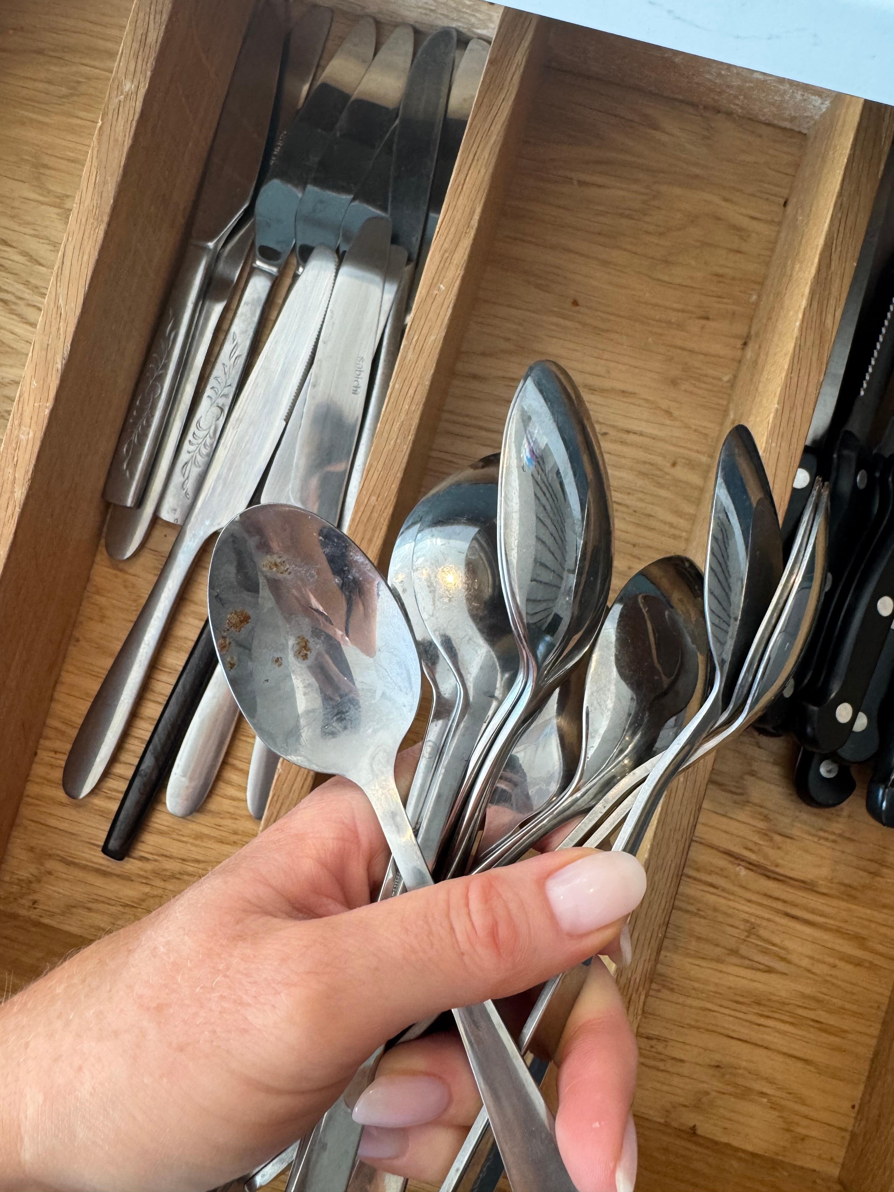 Food on cutlery in the drawer