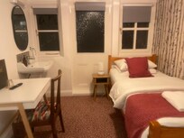 Small but functional, a table lamp and plugs near the bed.