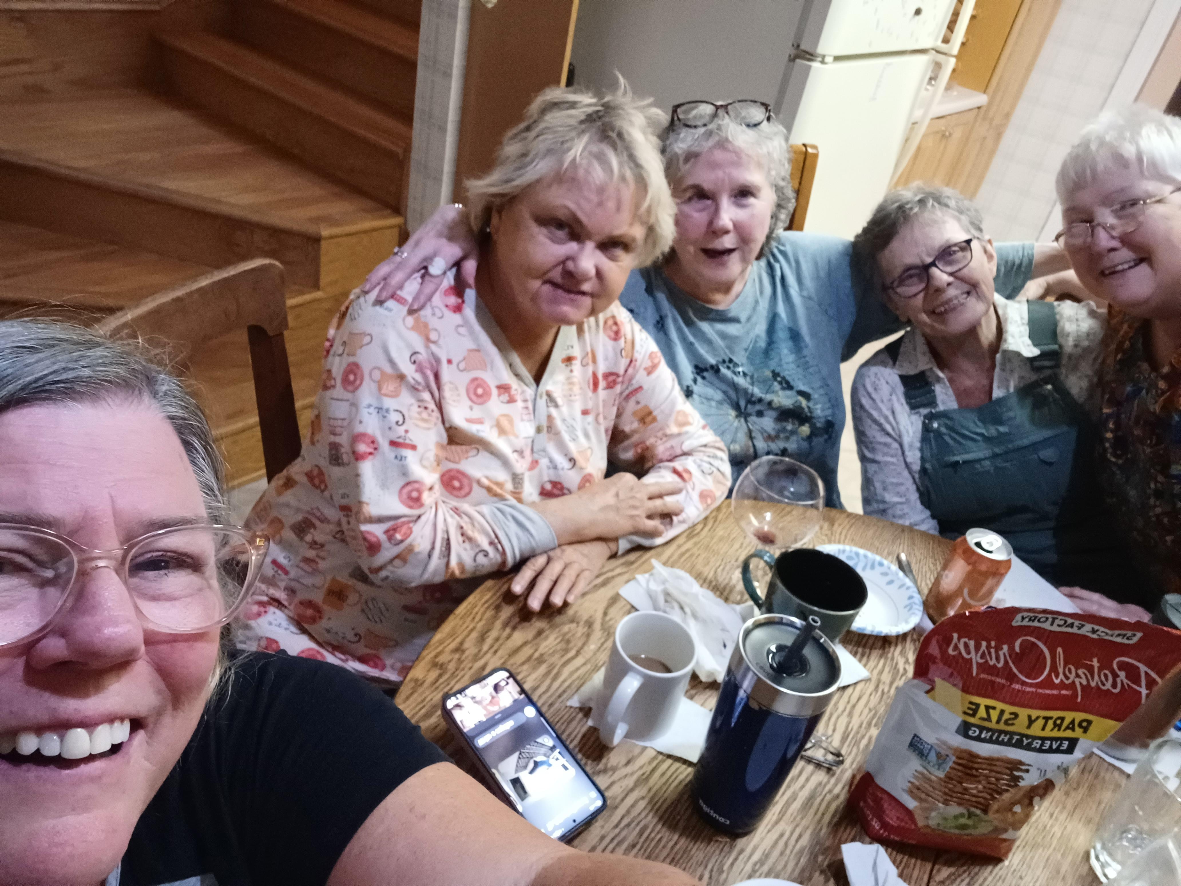 Sitting around the kitchen table.