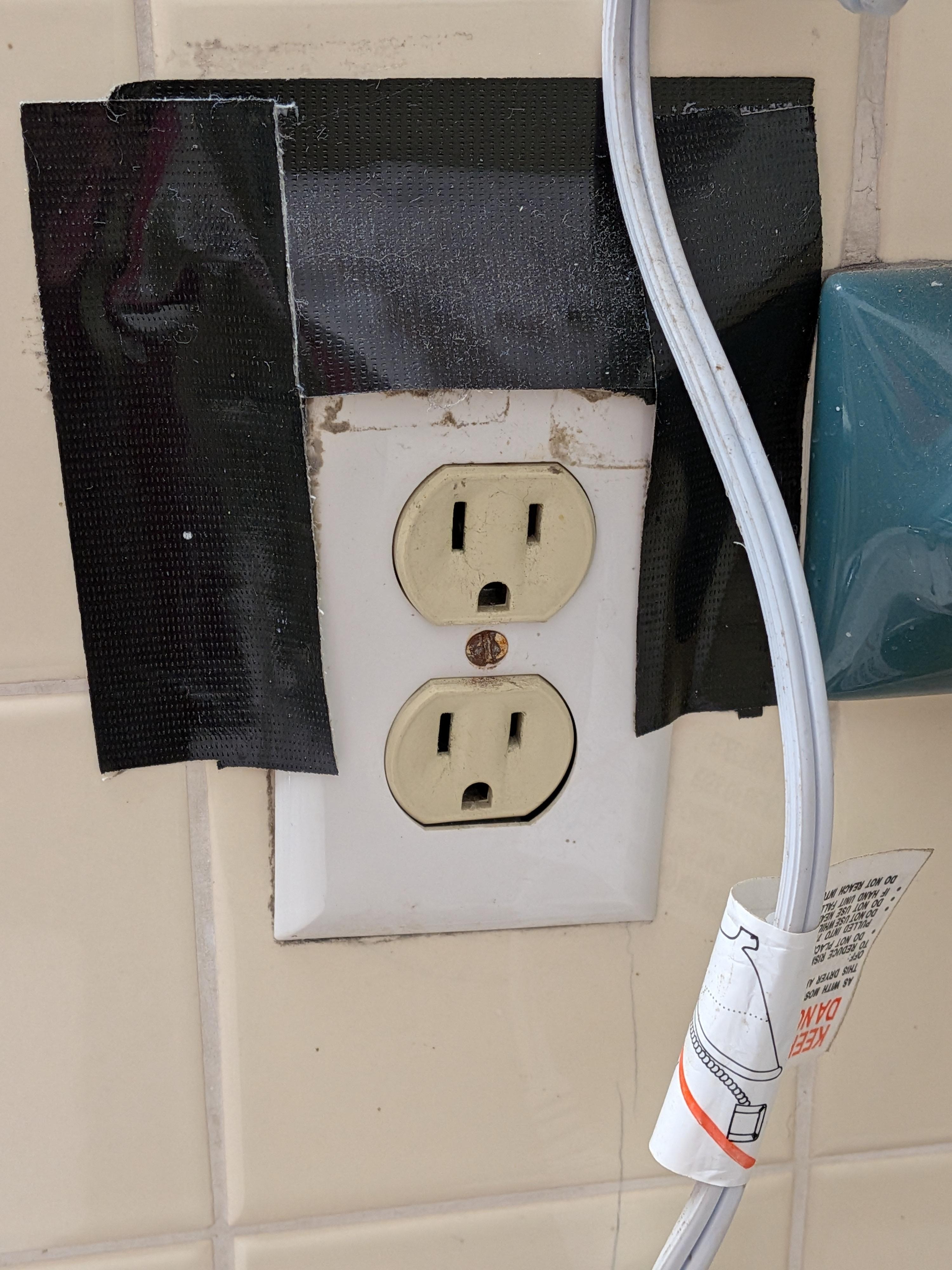 Electric in bathroom was duct taped to hold it to the wall - no ground fault!!!