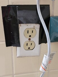 Electric in bathroom was duct taped to hold it to the wall - no ground fault!!!