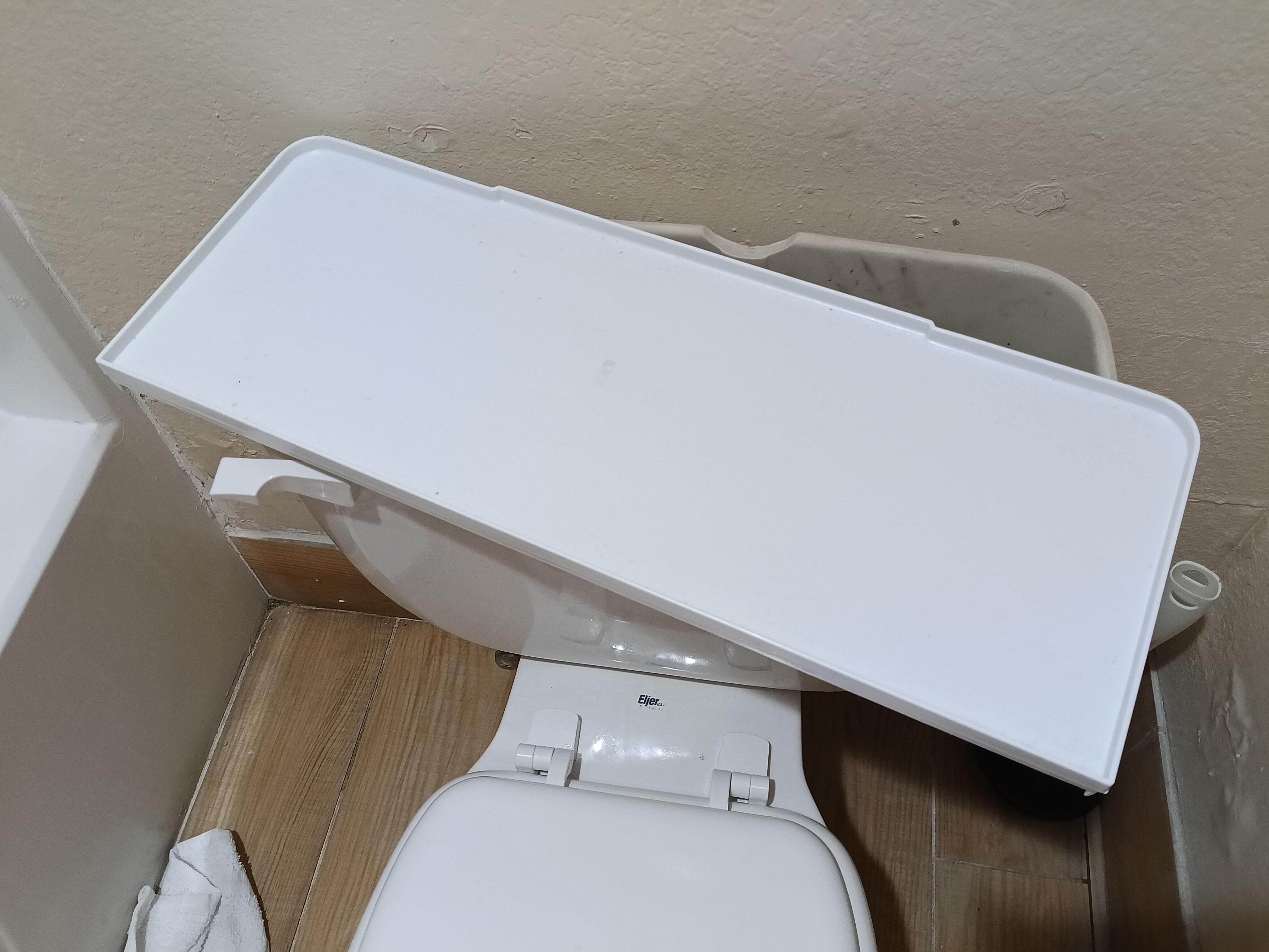 This is a piece of plastic on the tank. I even had to reach inside to make it flush