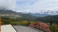 A view from the veranda with beautiful clouds in the sky.