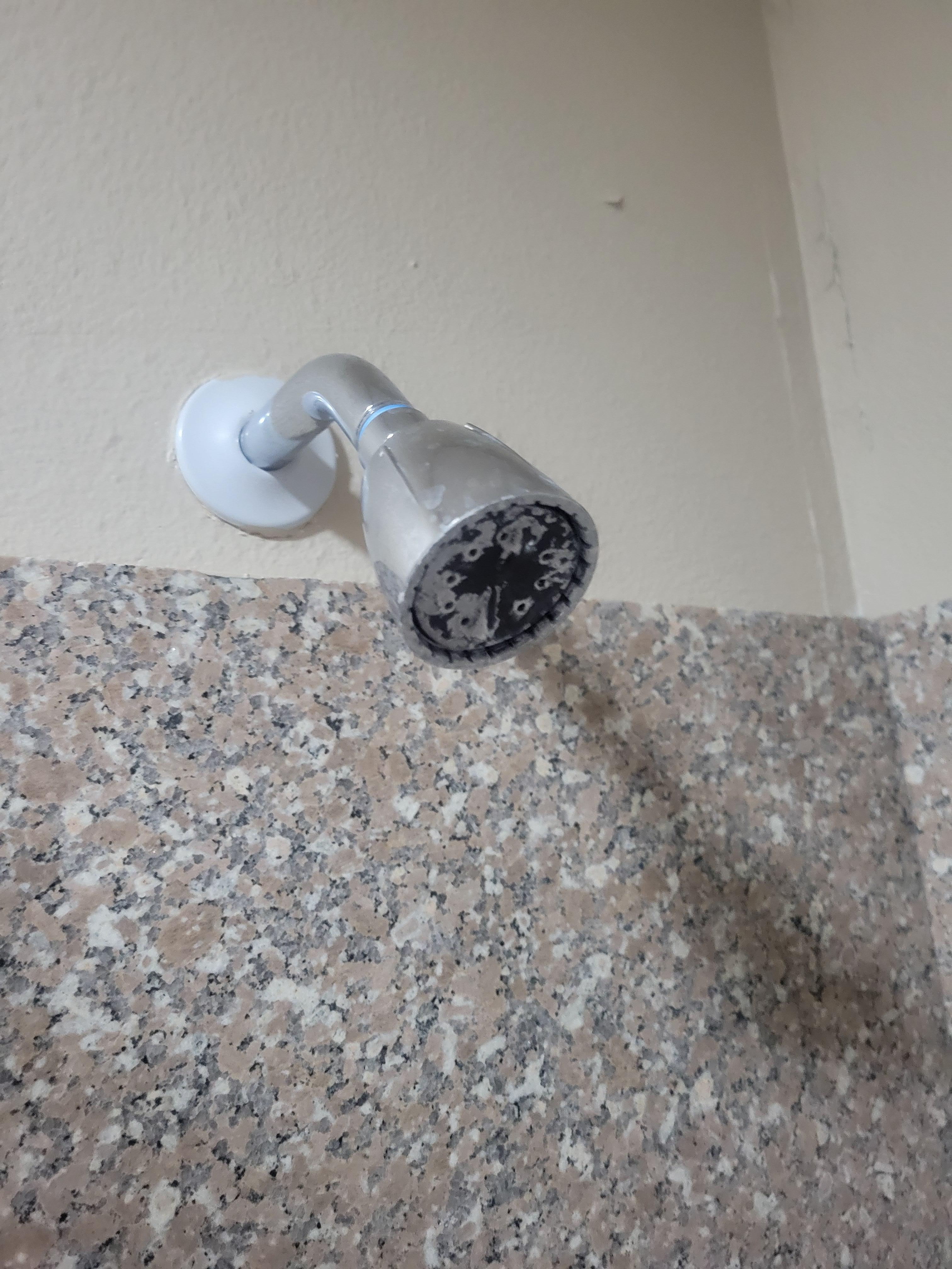 Shower head with gunk and mineral buildup