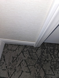 Loose or damaged base board.