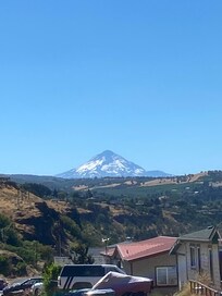 A picture of Mount Hood, heading down the road to town