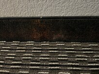 This looked to me like someone had thrown up and it splattered onto the baseboard. Unknown substance.