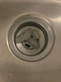 Ice and food particles still in the sink