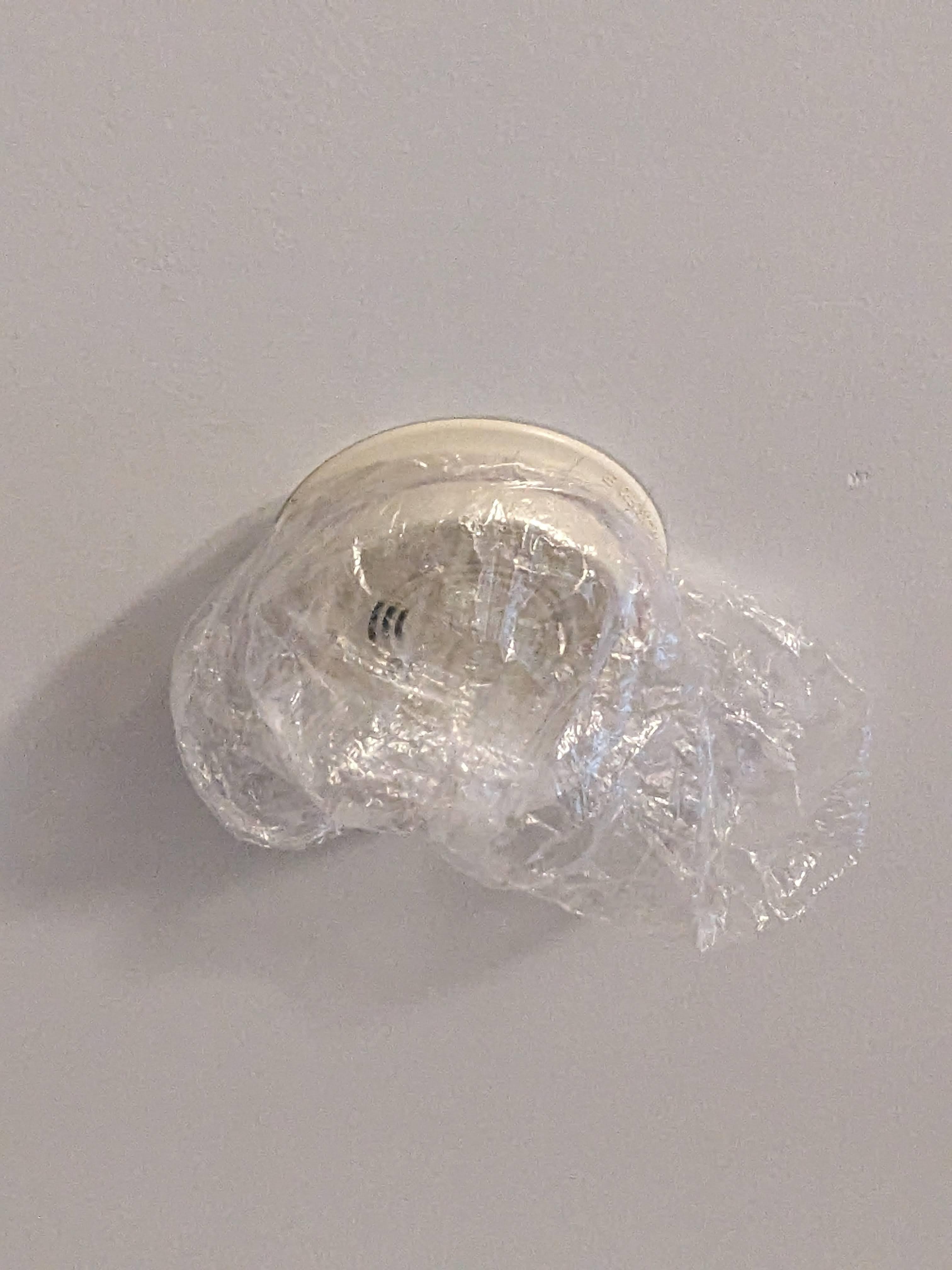 Smoke detector covered by a plastic bag. Not fixed by maintenance