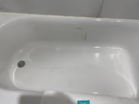 A sticker must have been removed and the adhesive in still on the tub. 5 minutes with Goo Gone and it would be gone.