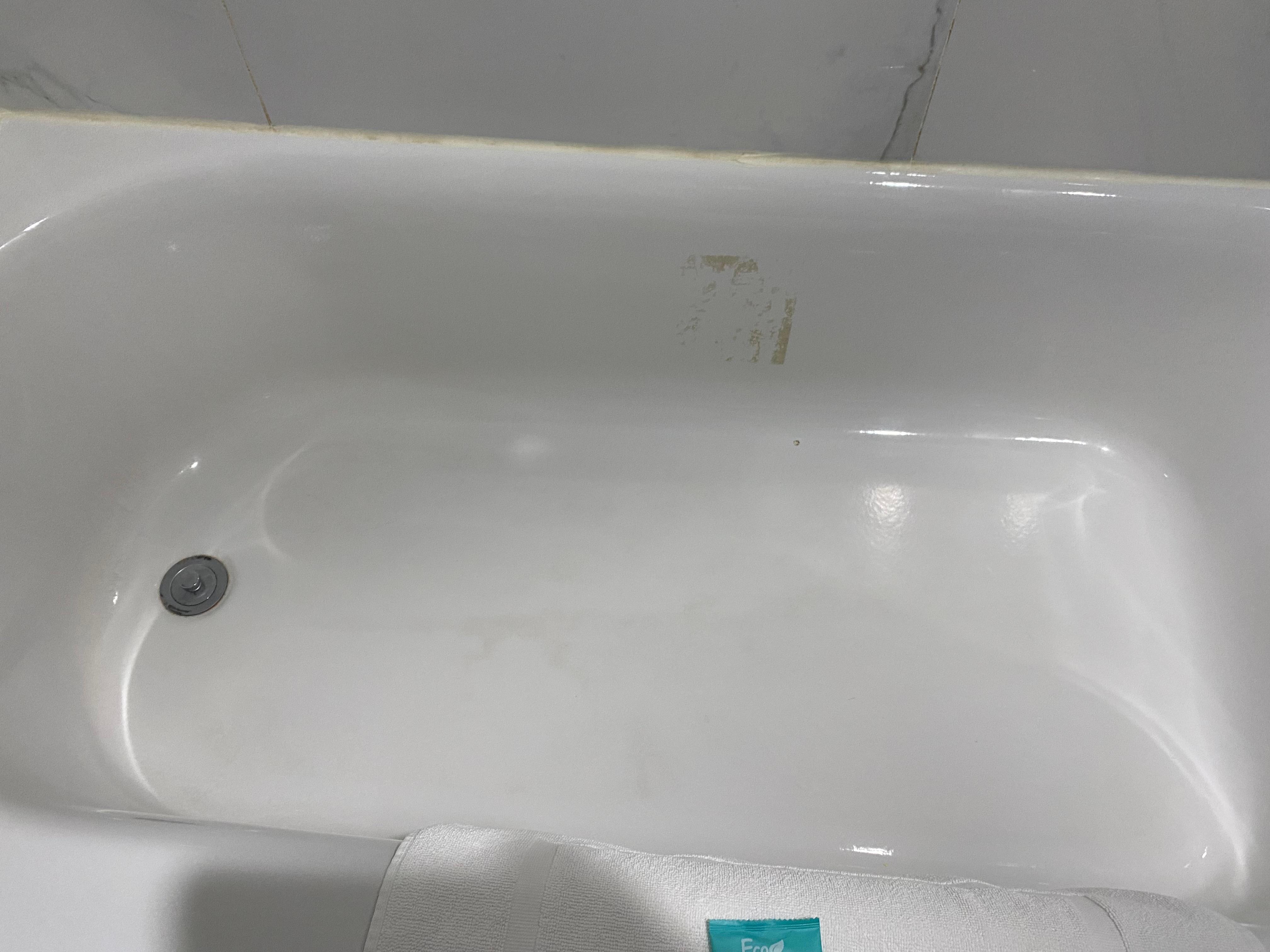 A sticker must have been removed and the adhesive in still on the tub. 5 minutes with Goo Gone and it would be gone.