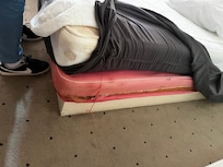Highly stained a ripped beds.