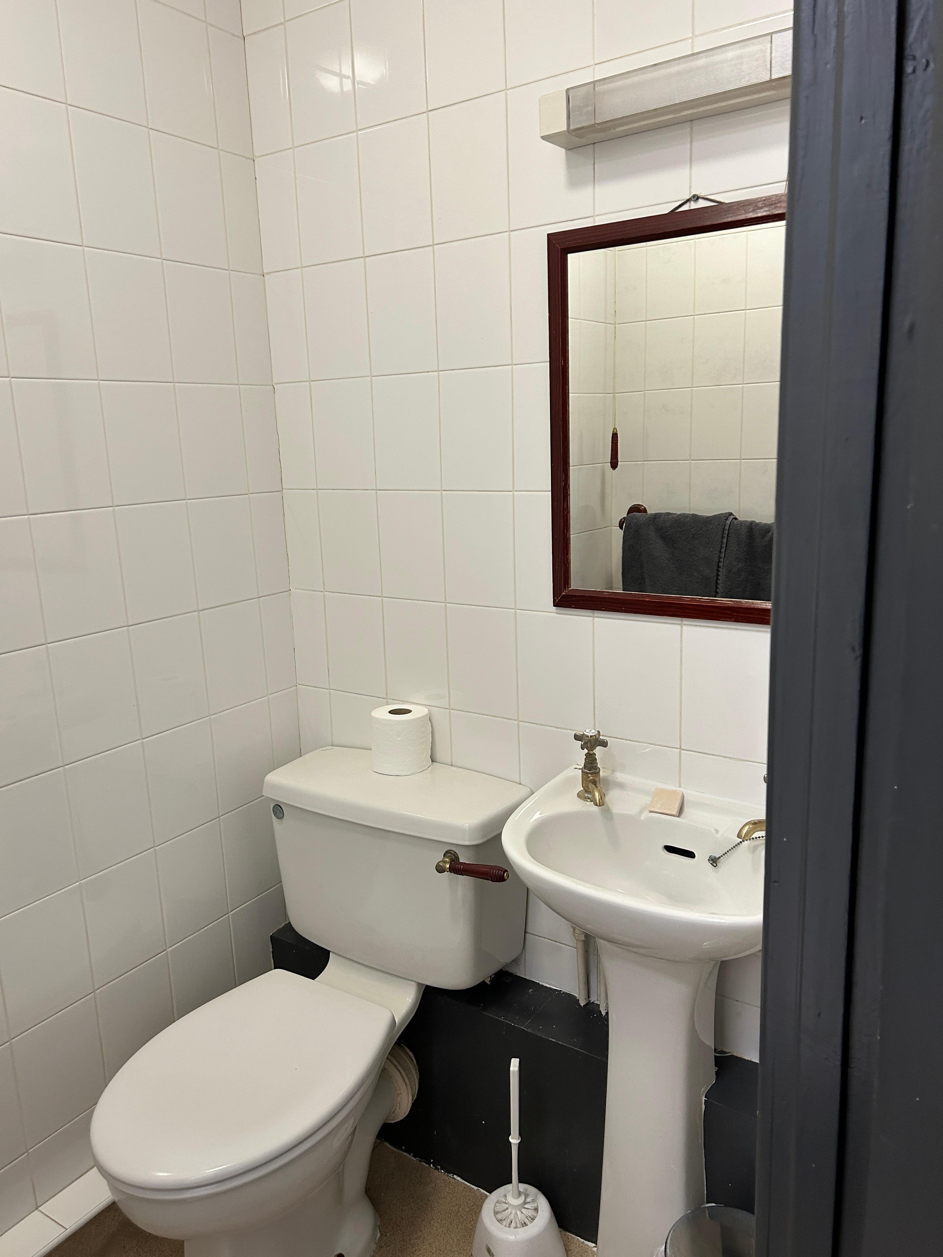 Look at the colour of the string hanging the bathroom mirror to see the dirt buildup. 