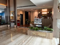 Nice lobby with the front desk and a bakery