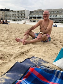 My husband, celebrating his birthday on the beach outside