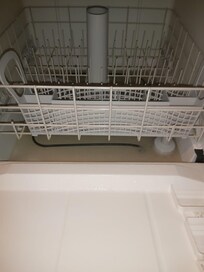 Scum and water in dishwasher