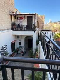 A second view from the rooftop patio showing the courtyard
