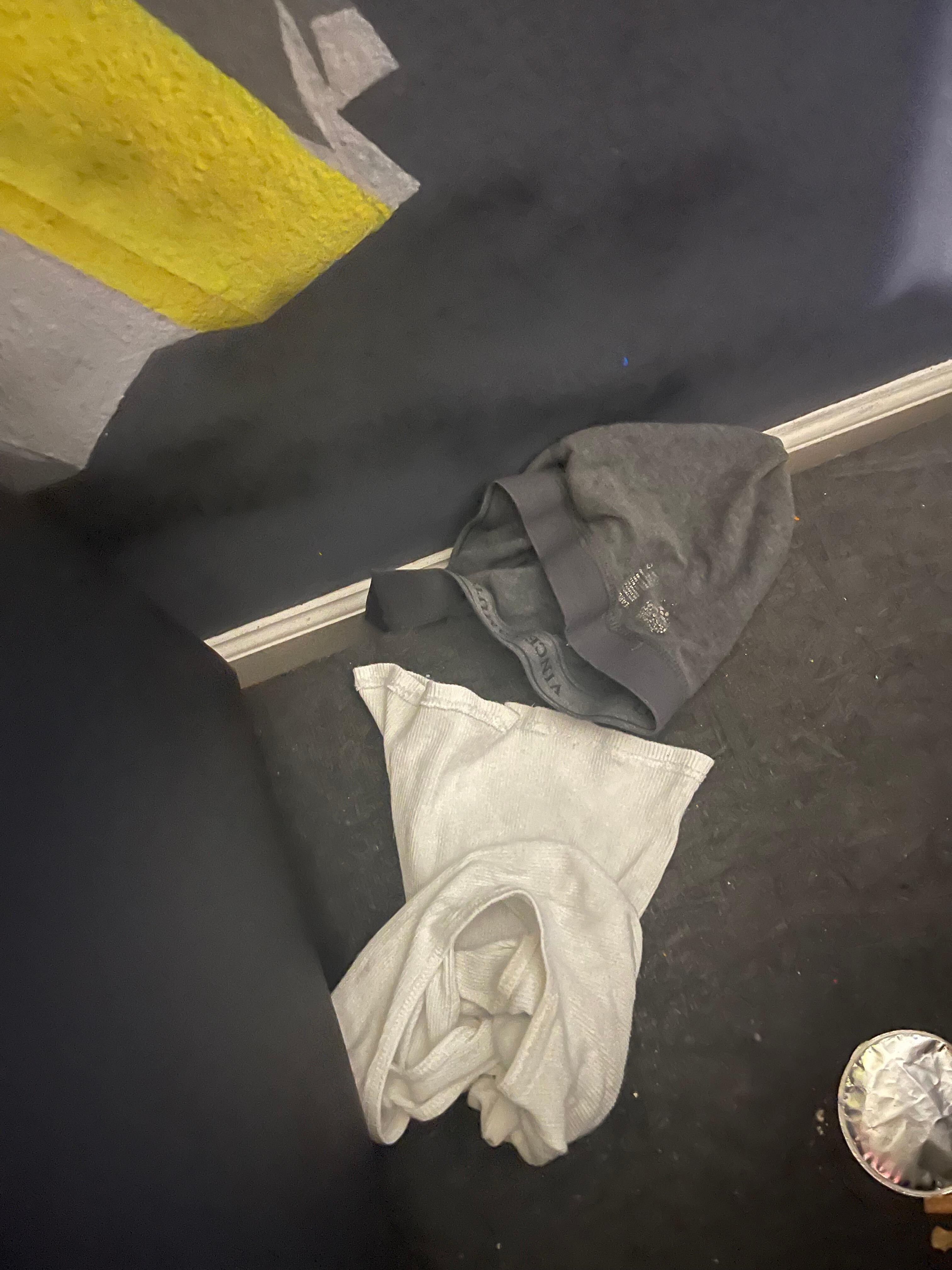 Dirty underwear and T-shirt left under the chair in the movie room