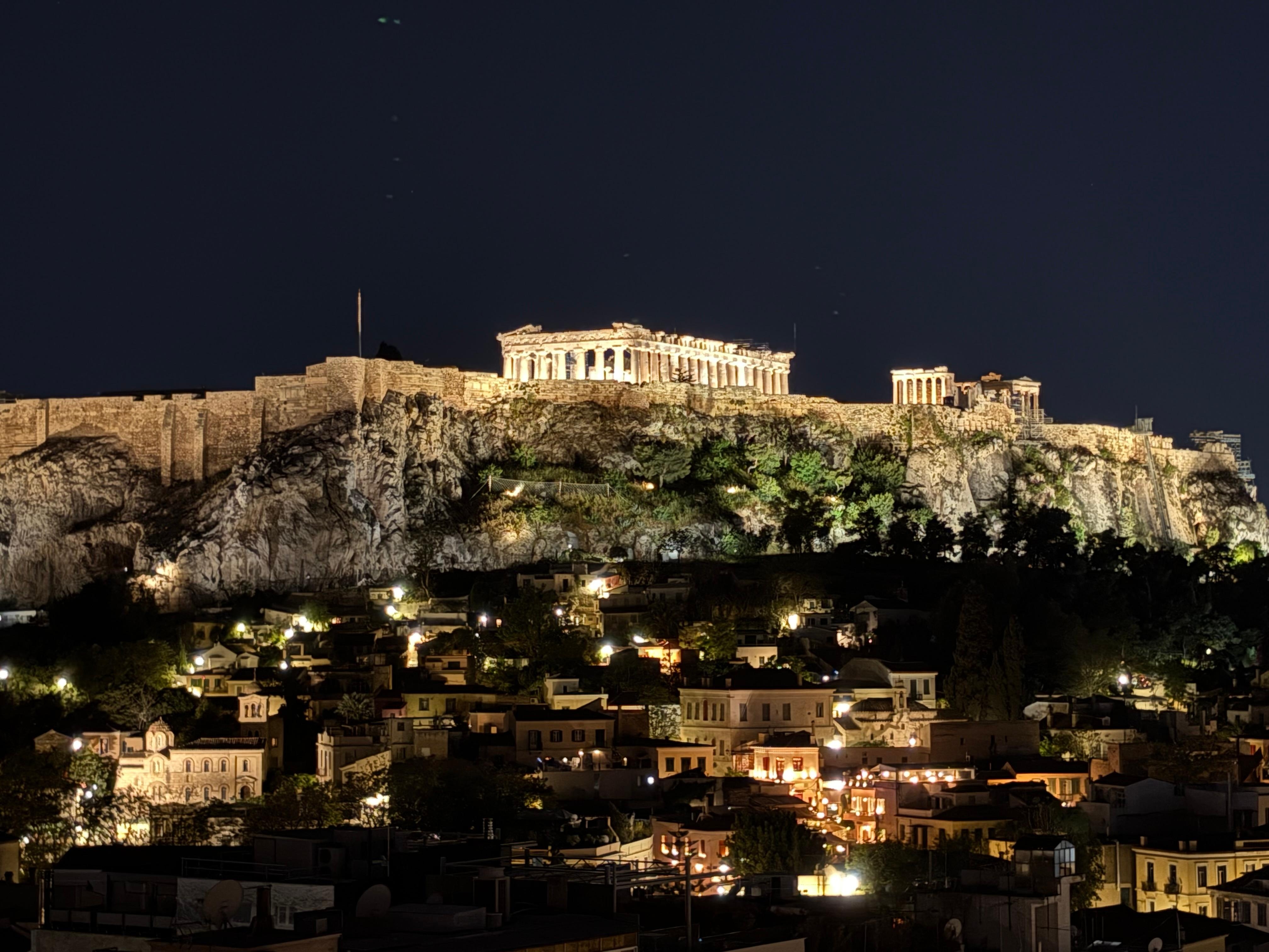 Rooftop drinks along with a beautiful view at night.