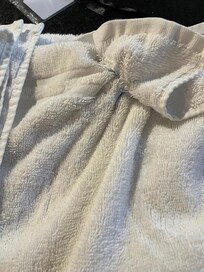 This was supposedly a "clean" towel that was sent the following morning by the cleaners since the towels we received were worn and didn't even match. Note the blue substance that was stuck in the towel. It was disgusting! You couldn't even pull it