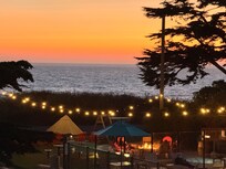 View at night of pool and outdoor seating