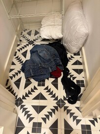 Dirty clothes in master bedroom closet left by someone else