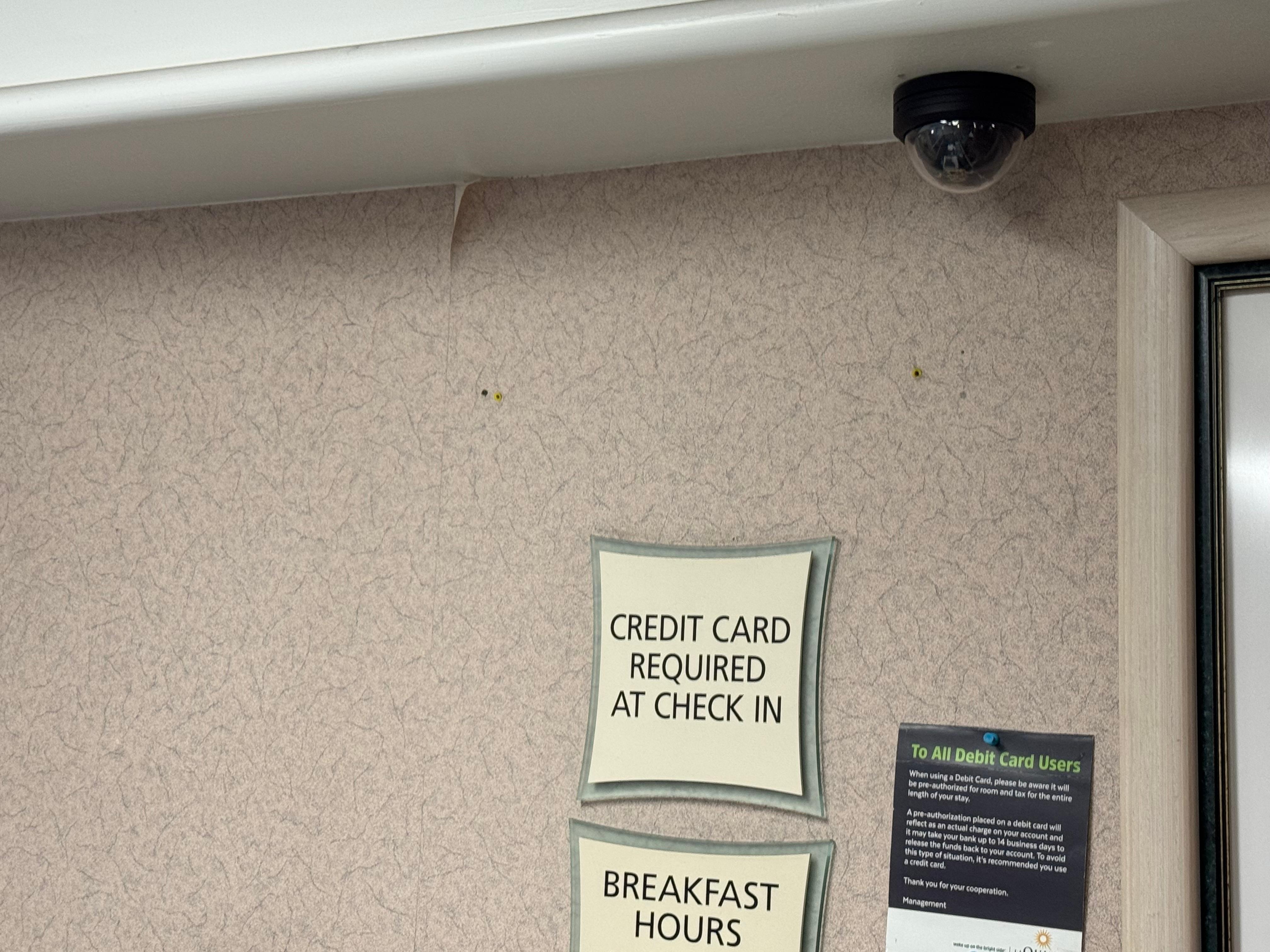 Wallpaper is coming off the wall in the registration area. Did not take pictures of peeling paint on doors as it was too dark when we arrived.