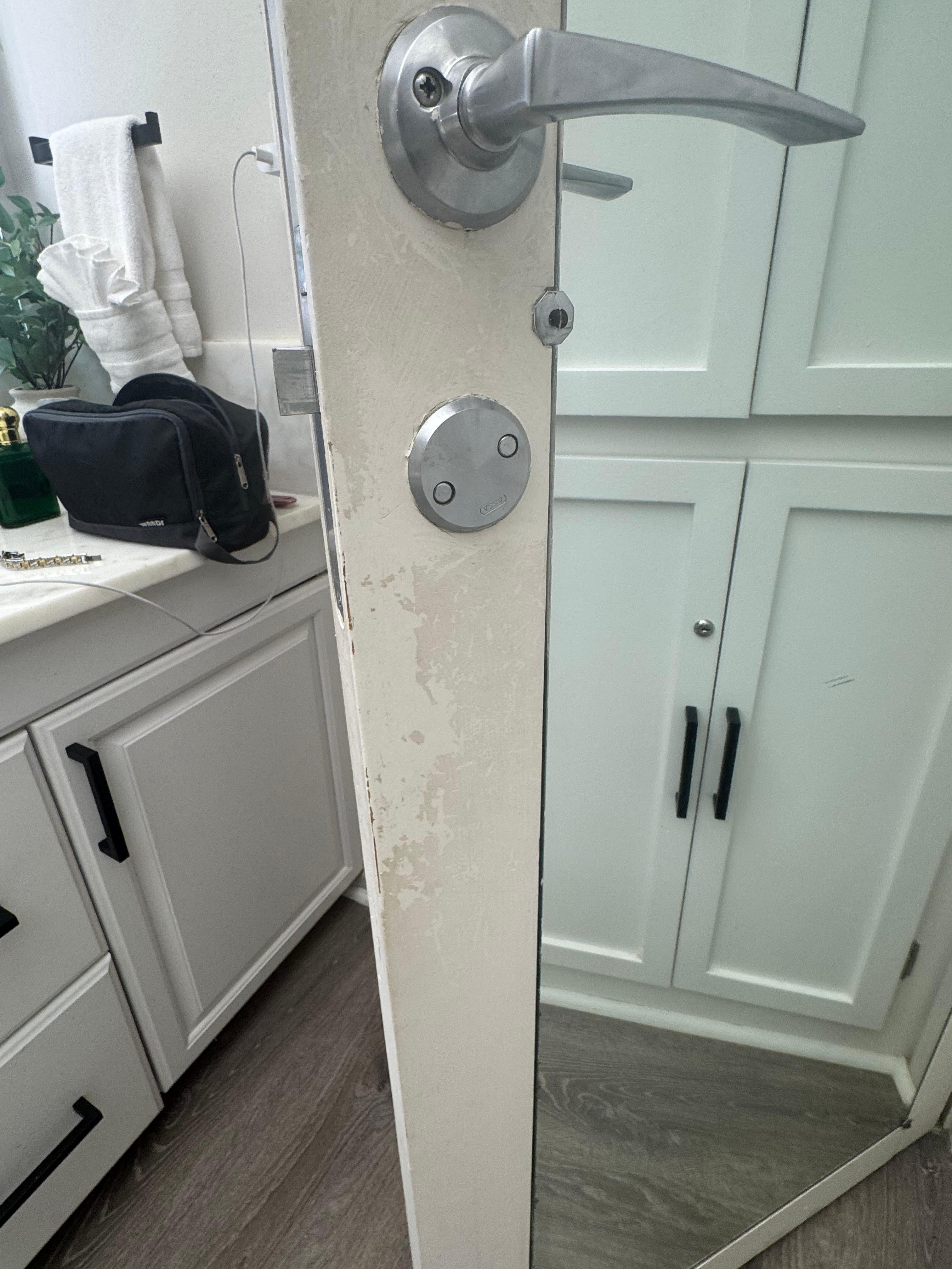 Dirt/worn condition on bathroom door.