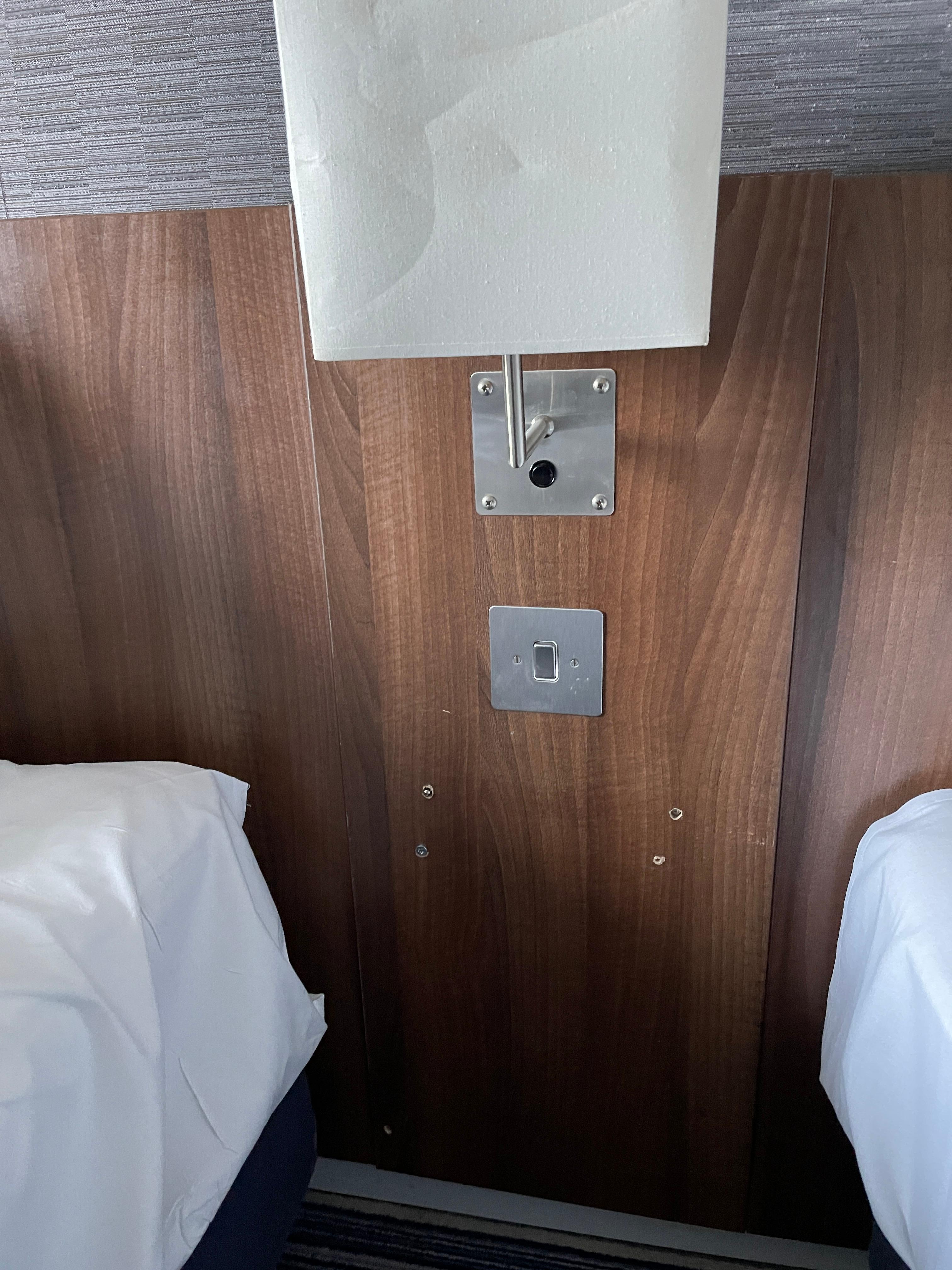 Missing/broken side table in-between twin beds