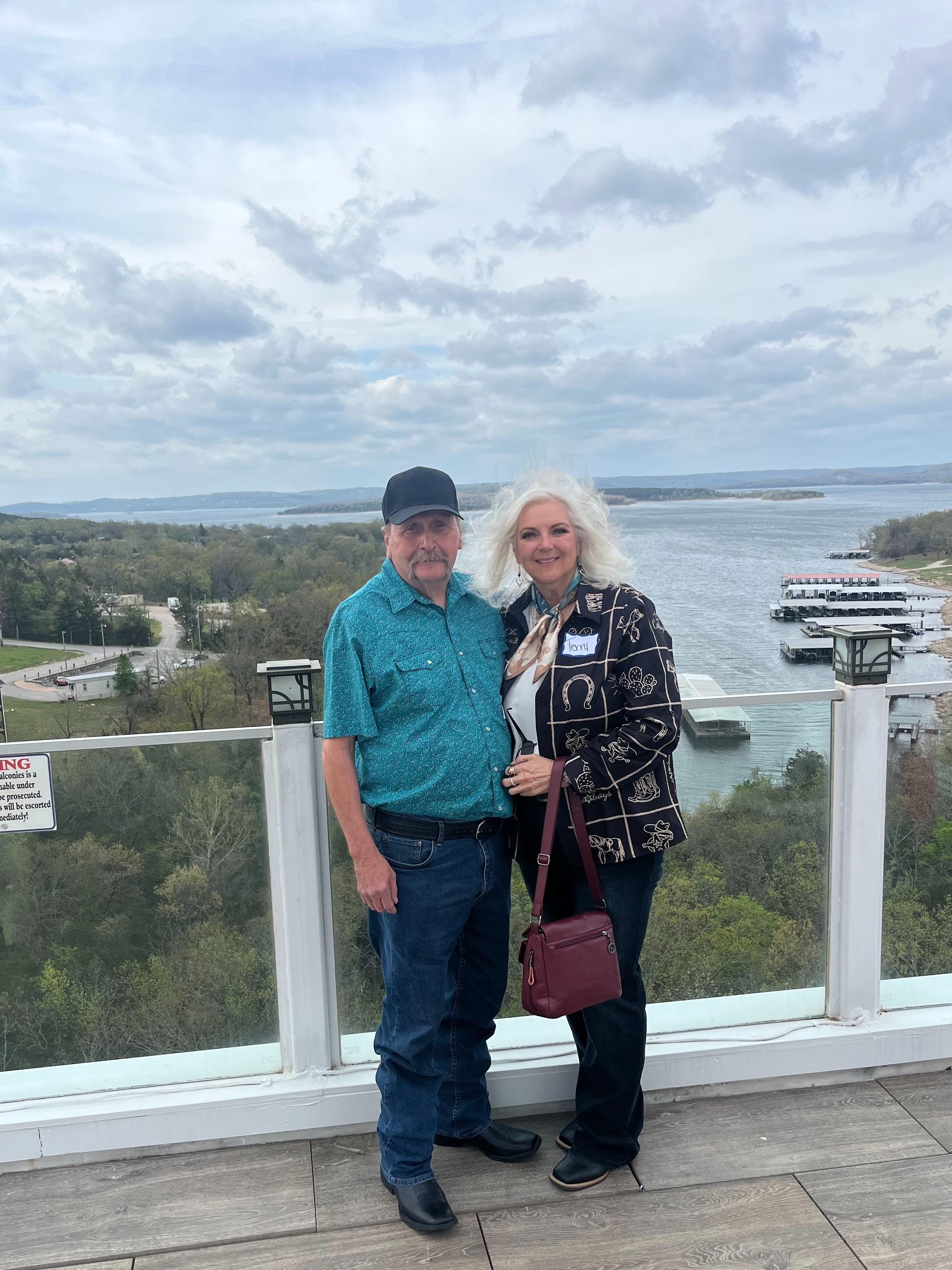 We were on a time sharing tour, we did not buy in, but glad our sales guy took this caption of us. This was top level of the tall building of Nantucket Condo’s Resort, Great caption with Table Rock lake background! 