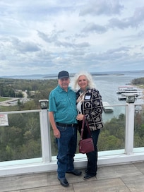 We were on a time sharing tour, we did not buy in, but glad our sales guy took this caption of us. This was top level of the tall building of Nantucket Condo’s Resort, Great caption with Table Rock lake background!