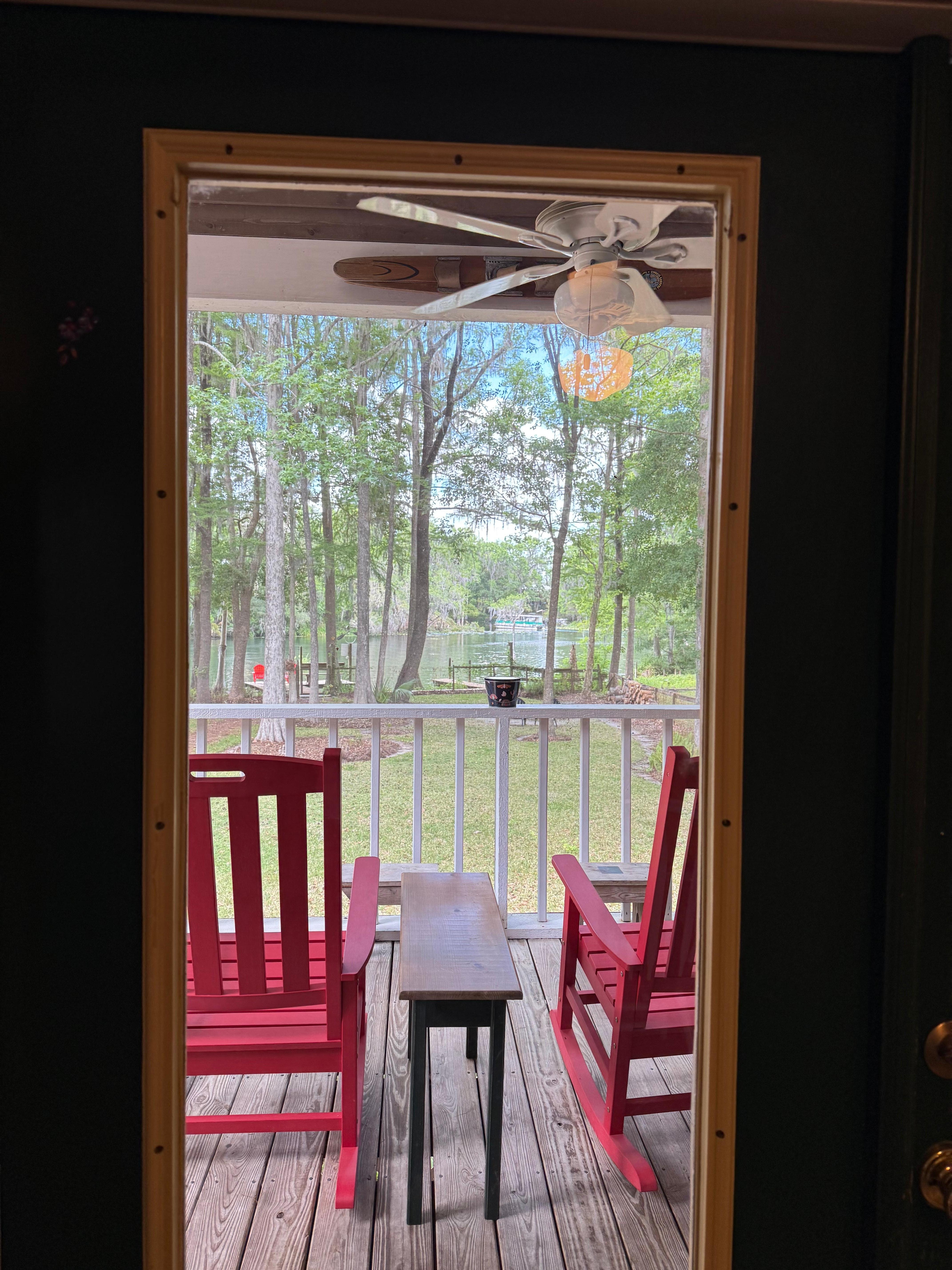 Large screened lanai with a lots of seating 