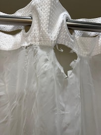 Torn shower curtain