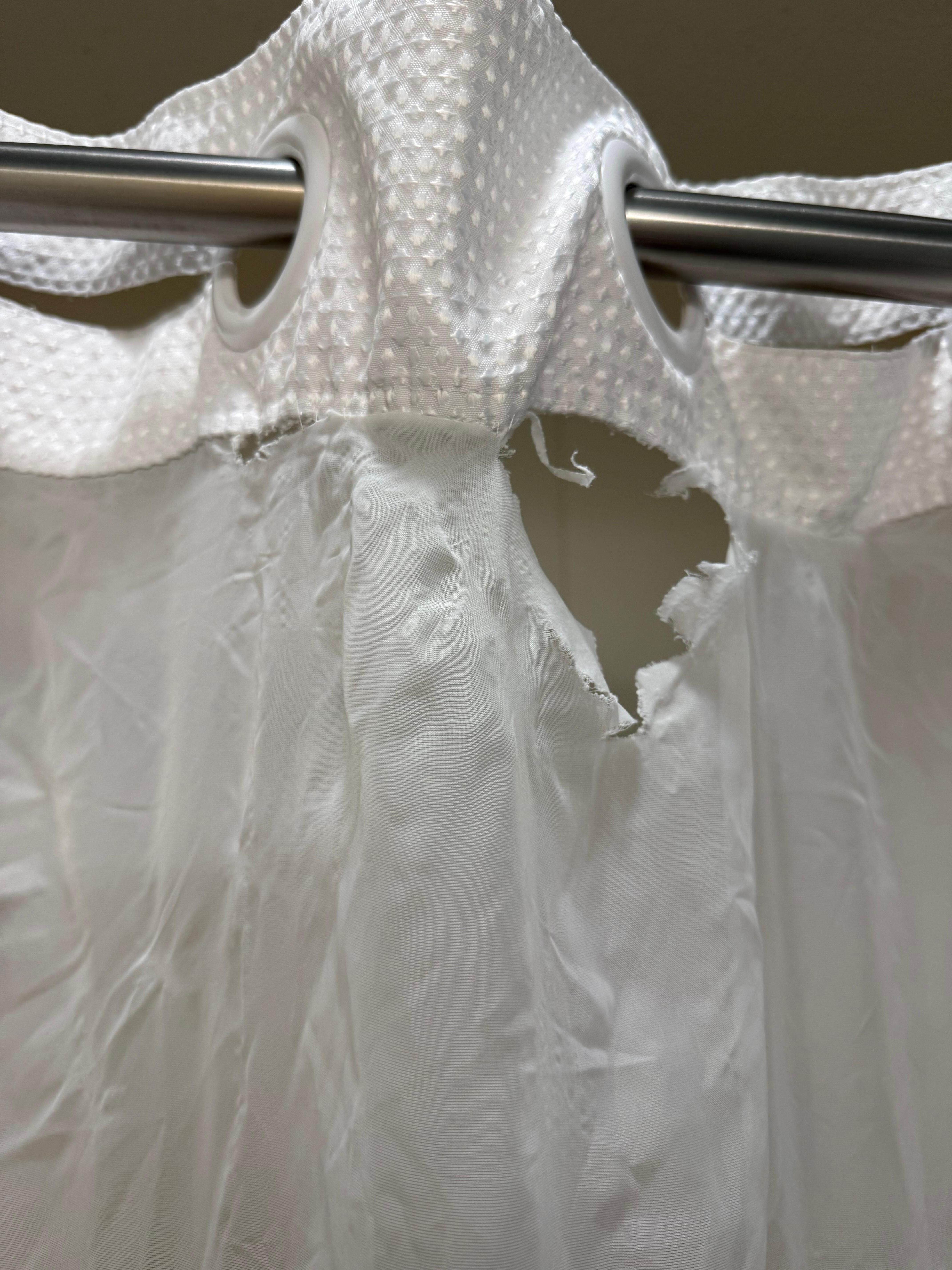 Torn shower curtain 