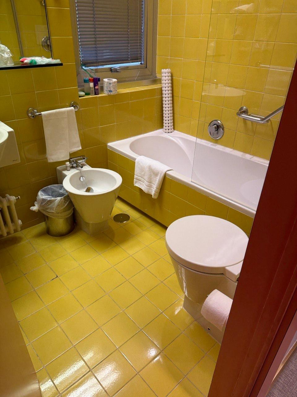 Bathroom with mustard tiles