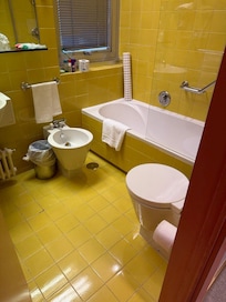 Bathroom with mustard tiles