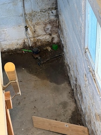 Nasty trash piled in the basement