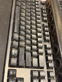 2 PCs on desk in the room, just next to bed. ALL COVERED IN DUST.