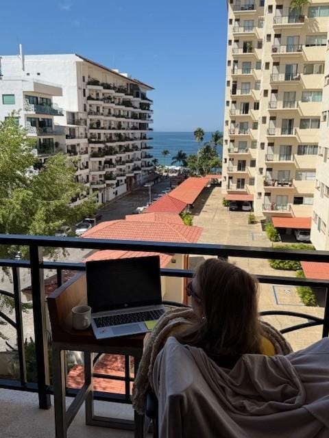 These two photos are from the same balcony, sunset pic is zoomed, this one is standard.
There is one building between this unit and the beach.