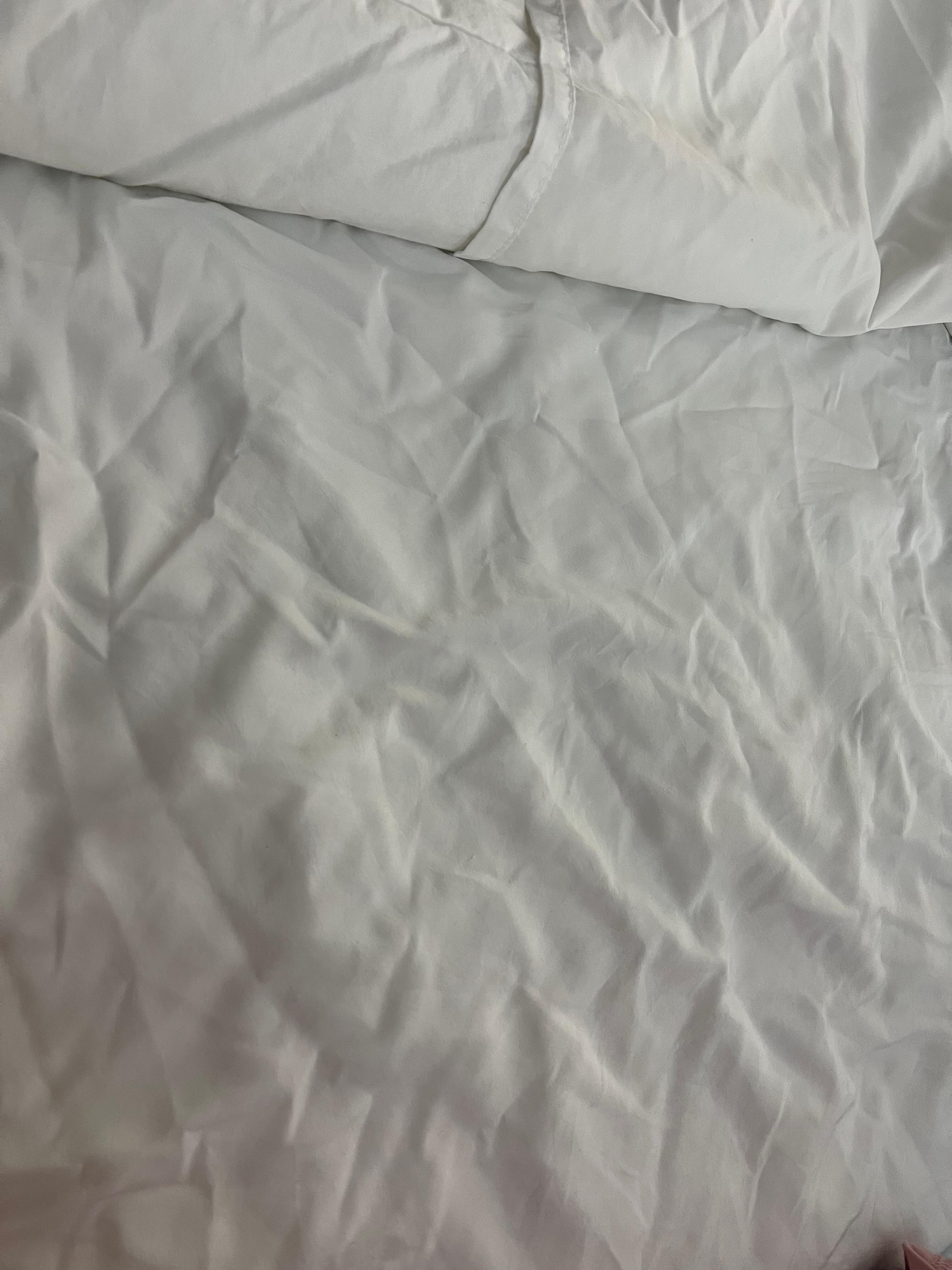 Wrinkled bed sheets like someone was sleeping in the bed before me.
