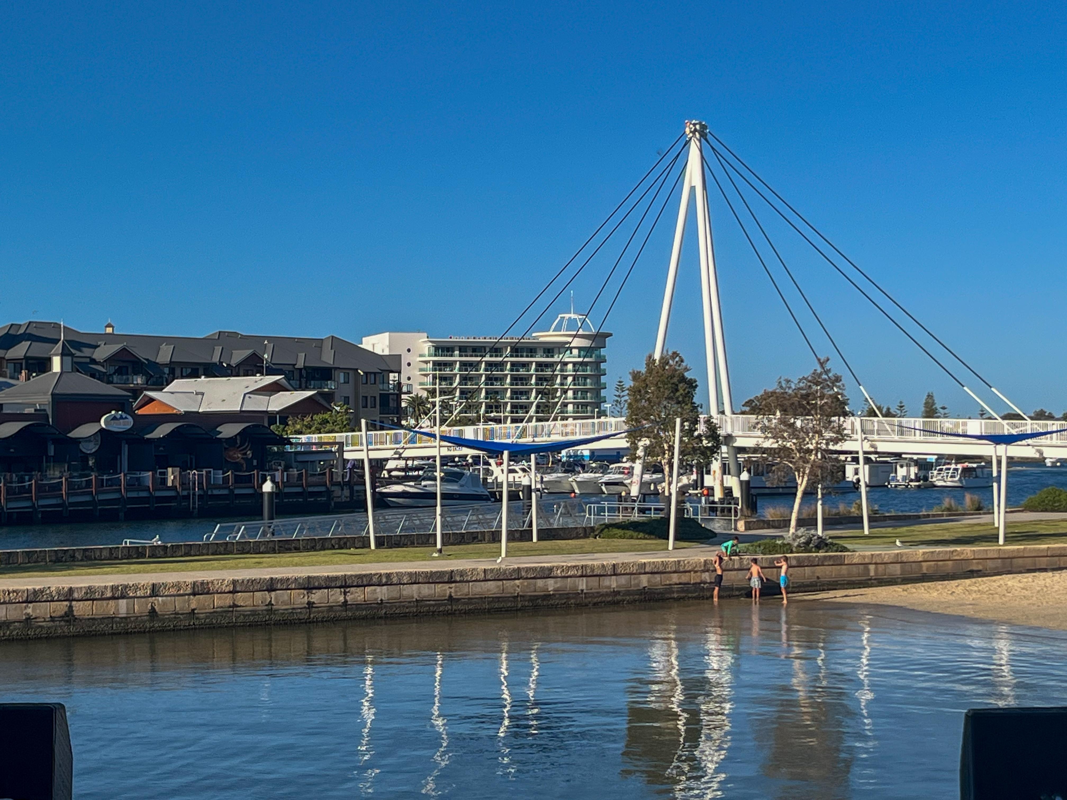 View of hotel in distance, standing outside a restaurant in Dolphin Quay, a short walk away.