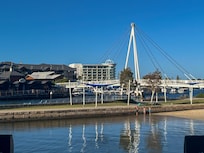 View of hotel in distance, standing outside a restaurant in Dolphin Quay, a short walk away.