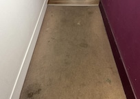 worn carpet on the hallway